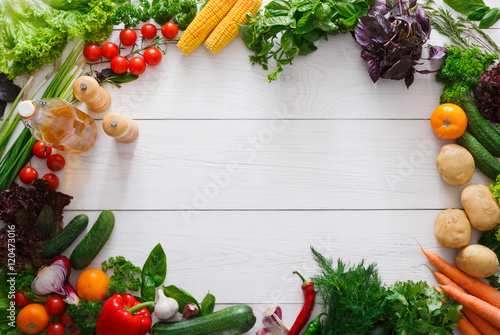 Fresh vegetables frame on white wood background with copy space