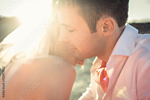 Fotografie groom and bride hugging  each other