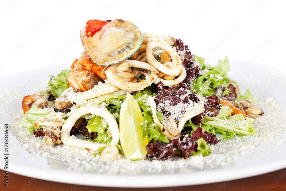 Warm salad with seafood, boiled eggs, lemon, red caviar and raw Warm salad with seafood, boiled eggs, lemon, red caviar and raw