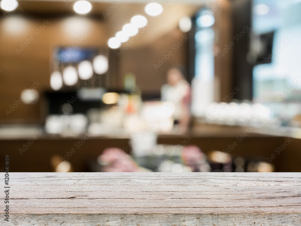 Wood table top on blur cafe restaurant with bokeh background Wood table top on blur cafe restaurant with bokeh background