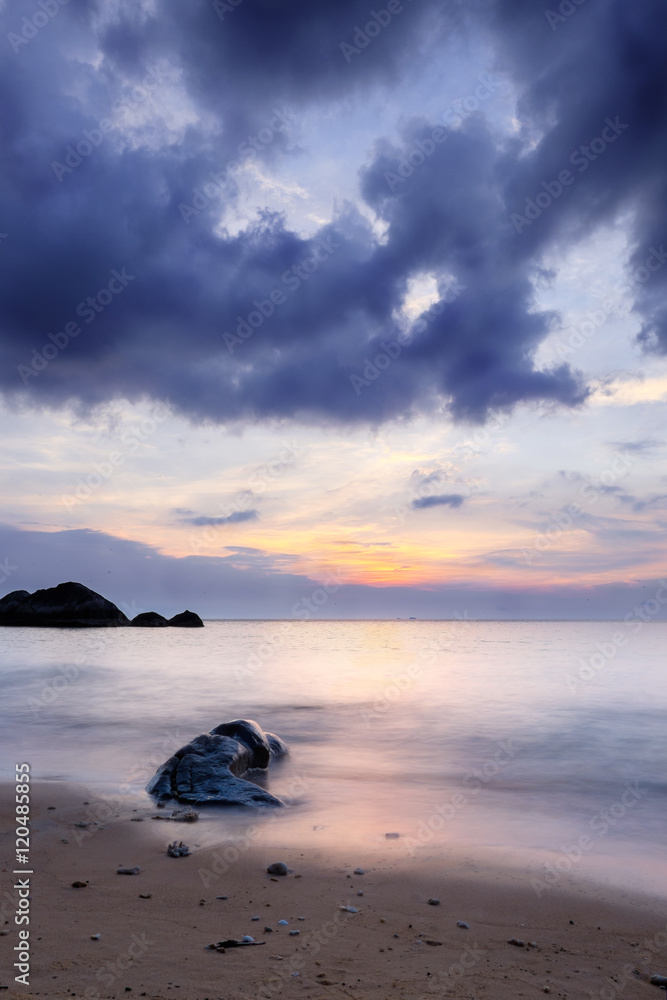 Long exposure sunset at exotic tropical island. Sand, stone and