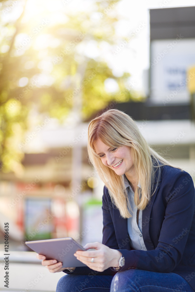 Smiling businesswoman using tablet Smiling businesswoman using tablet