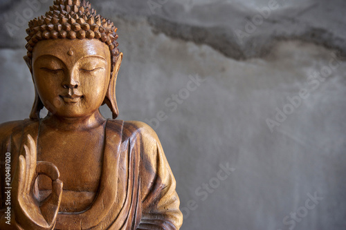 Fototapeta Wooden buddha statue