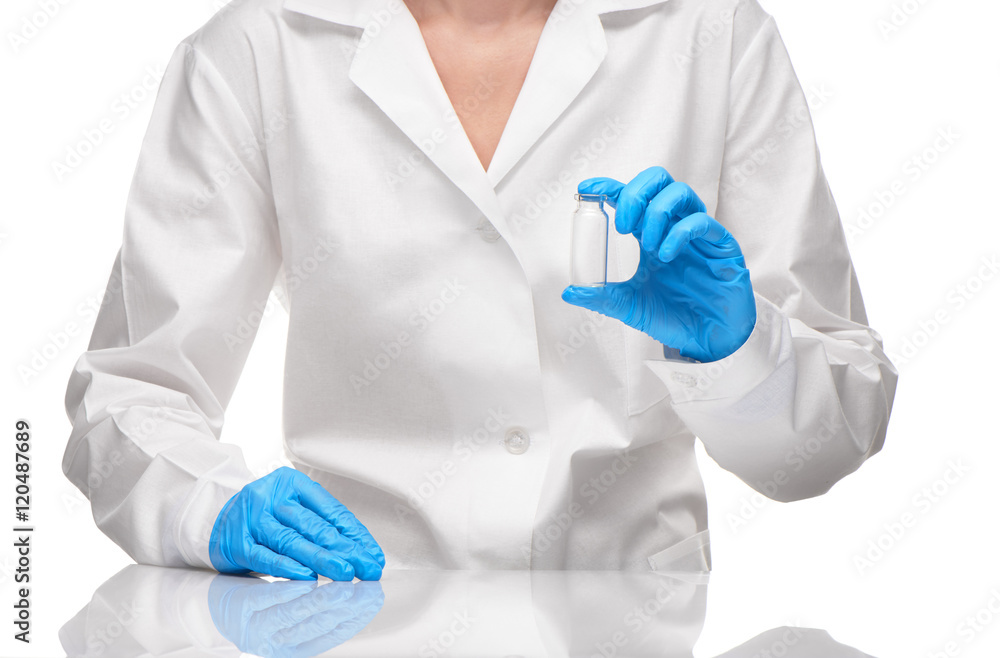 Doctor in gown and gloves holding empty ampoule against white Doctor in gown and gloves holding empty ampoule against white