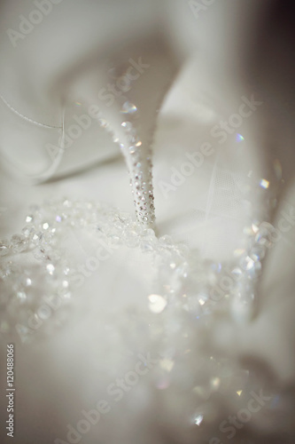 stylish white shoes with bright stones prepared for young bride