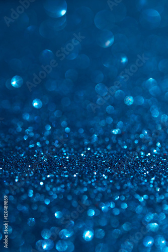 Abstract dark blue glitter bokeh holiday background. Winter xmas holidays. Christmas.