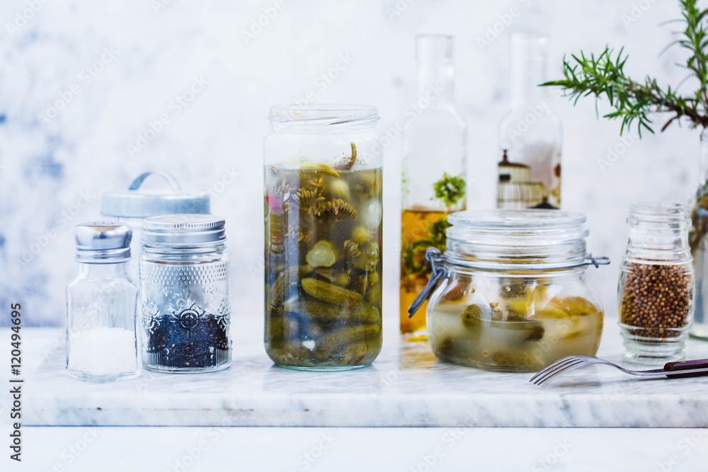 Cucumber marinated glass jar with pepper and garlic. Cucumber marinated glass jar with pepper and garlic.