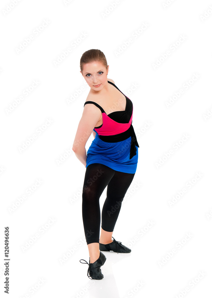 Healthy lifestyle - full length portrait of smiling young fitness girl in perfect shape. Sporty caucasian female model isolated on white background. Cheerful young woman doing stretch exercise. Healthy lifestyle - full length portrait of smiling young fitness girl in perfect shape. Sporty caucasian female model isolated on white background. Cheerful young woman doing stretch exercise.