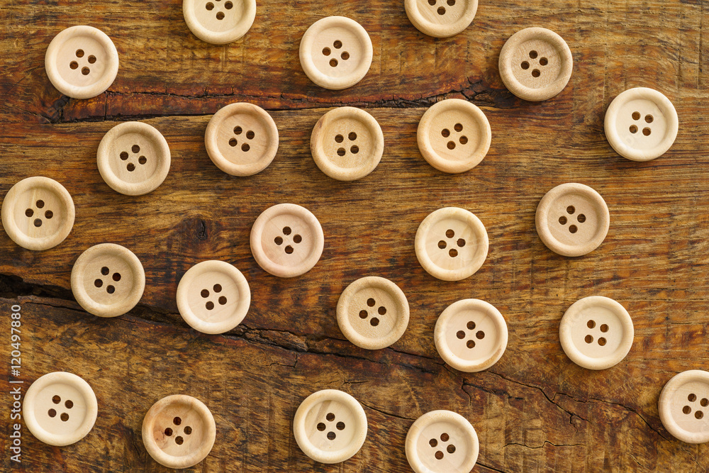 Collection of wooden buttons on wooden background Collection of wooden buttons on wooden background
