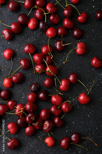 Photographie fresh cherries on dark background