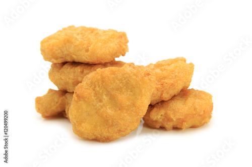 Fried chicken nuggets isolated on white background.