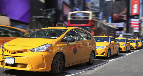 Yellow Taxis in Times Square is a major commercial intersection and neighborhood in Midtown Manhattan, New York City