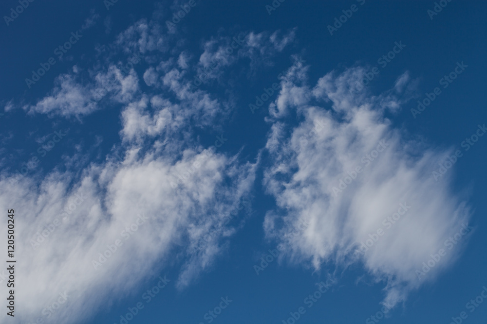 Fototapeta premium White clouds on a blue sky. Selective focus