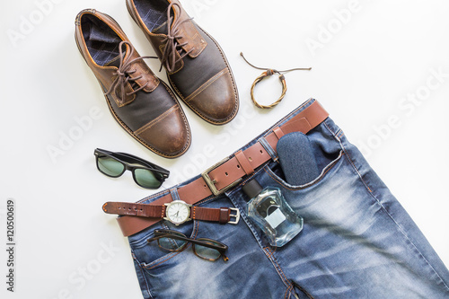 Men's casual outfits with brown leather shoes, blue jeans and accessories, flat lay, top view background