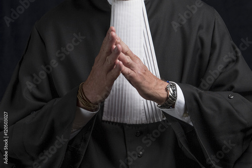 Lawyer in gown with jabot hands close up judge