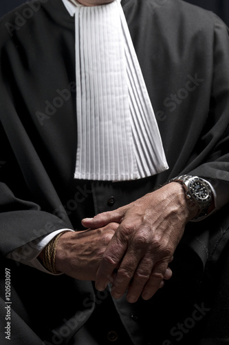 Lawyer in gown with jabot hands close up judge