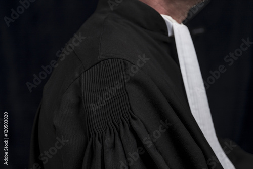 Lawyer in gown with jabot hands close up judge