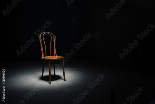 Lonely chair at the empty room photo