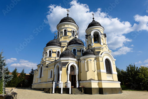 Photo of Capriana Monastery in Moldova with blue sky photo