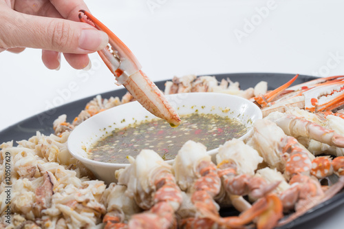 eating crabmeat with spicy thai sauce