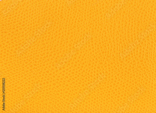 Bright yellow leather background closeup photo