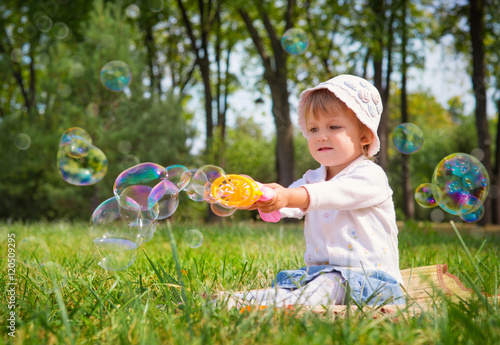 girl playing with soap bubbles