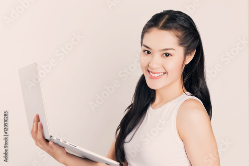 Young happy Asian woman with laptop, happy smiley face student w