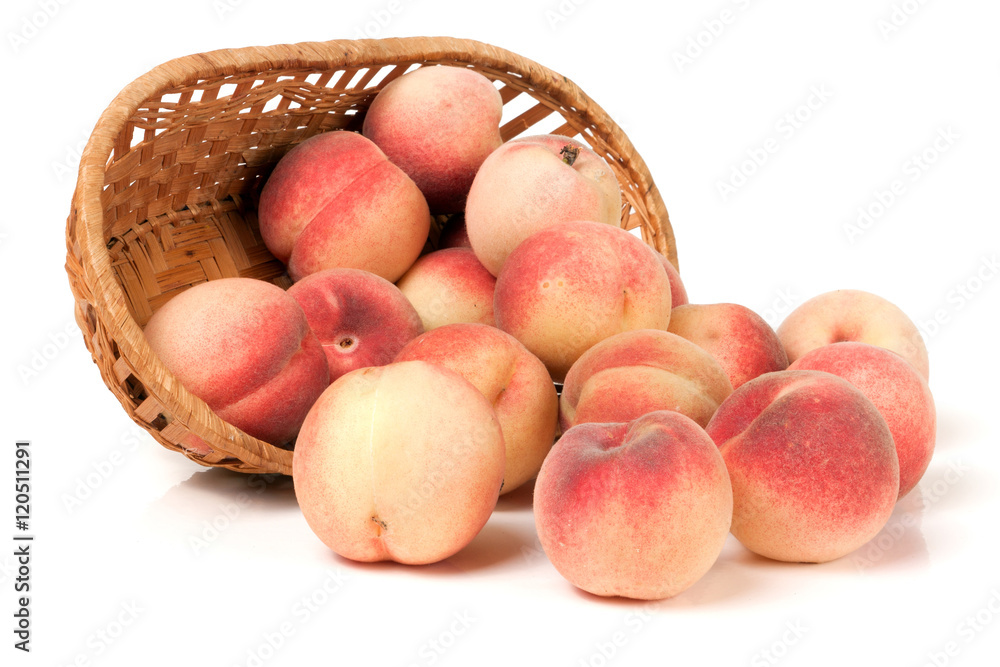 peaches in a wicker basket isolated on white background peaches in a wicker basket isolated on white background
