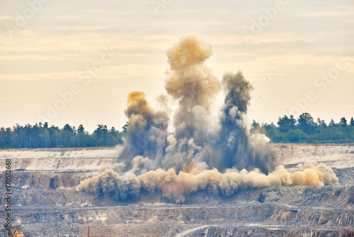 Fototapet Explosion blast in open cast mining quarry mine