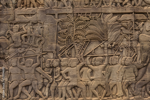 Bas-reliefs with war scenes in Bayon temple, Angkor, Cambodia