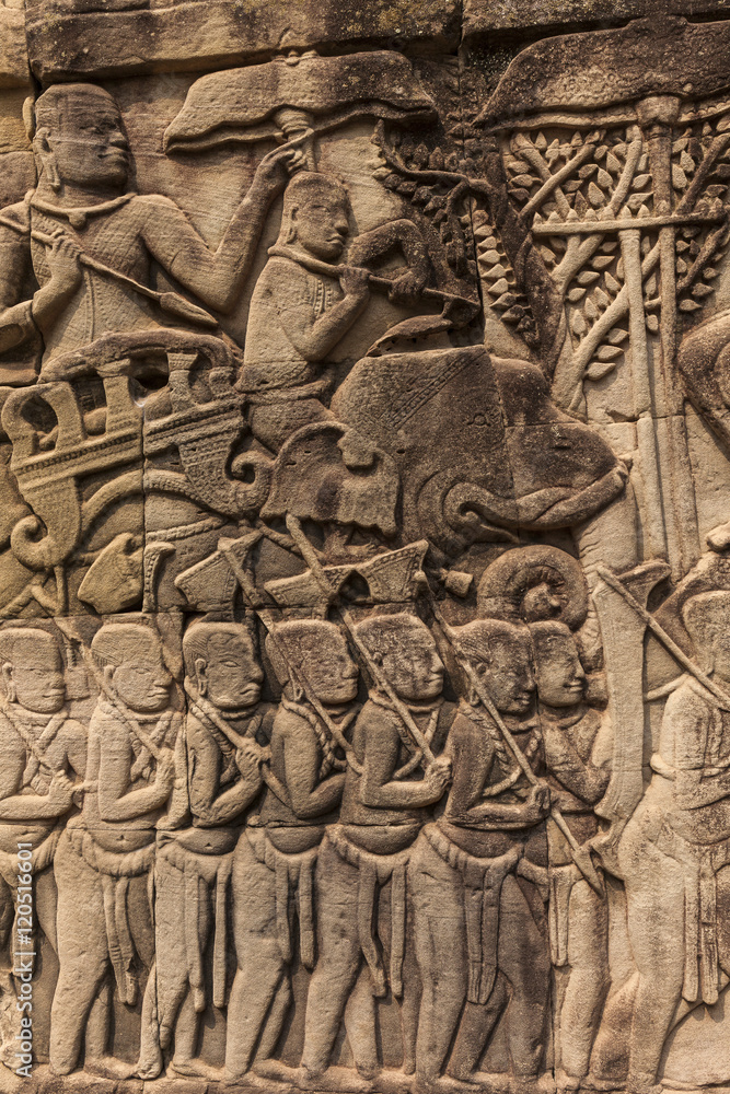 Bas-reliefs with war scenes in Bayon temple, Angkor, Cambodia