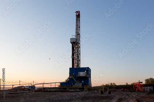 Oil derrick at the sunrise.