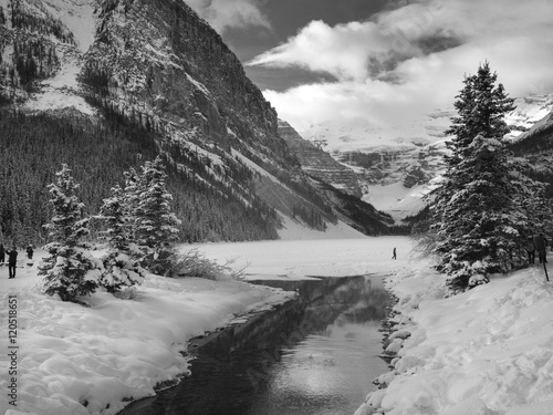 Stream flowing in snow covered valley in winter, Lake Louise, Ba