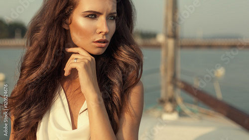 High fashion portrait of beautiful elegnt woman with silver ring photo