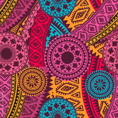 Seamless vector tribal texture. Vintage ethnic seamless backdrop. Tribal seamless texture. Striped vintage boho fashion style pattern background with tribal shape elements.