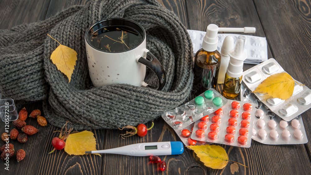 Pills, nose drops and hot tea with lemon for colds, treatment of , flu runny - obrazy, fototapety, plakaty 