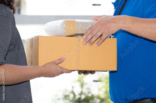 Woman hand accepting a delivery of boxes from deliveryman © comzeal