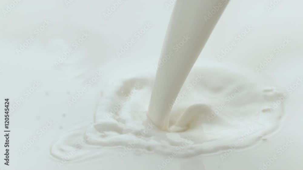 Milk pouring and splashing in slow motion; shot on Phantom Flex 4K at 1000 fps Milk pouring and splashing in slow motion; shot on Phantom Flex 4K at 1000 fps