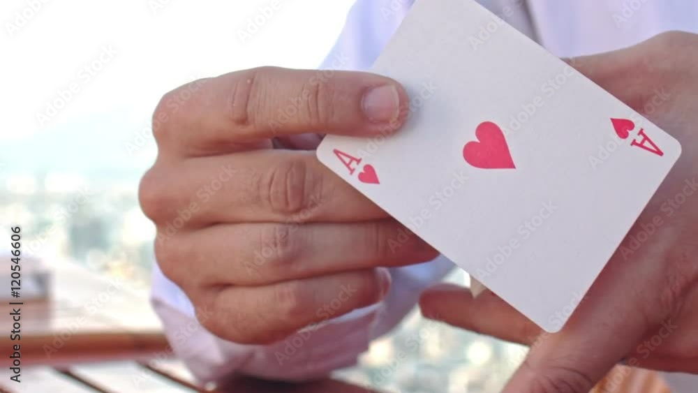 Closeup Conjurer Hands Shows Ace of Hearts Card Trick Closeup Conjurer Hands Shows Ace of Hearts Card Trick