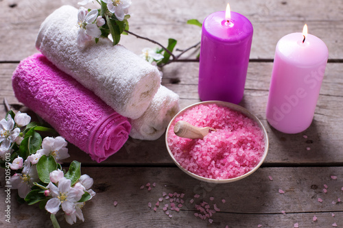  Spa or wellness setting. Sea salt in bowl  towels  candles and