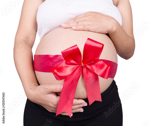 Wallpaper Mural close up pregnant woman with red ribbon gift on belly isolated o Torontodigital.ca