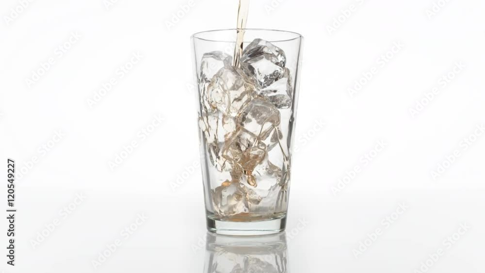 Pouring ice tea into glass with ice cubes . Shot with high speed camera, phantom flex 4K. Slow Motion. Pouring ice tea into glass with ice cubes . Shot with high speed camera, phantom flex 4K. Slow Motion.