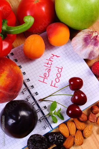 Fruits and vegetables with notebook, slimming and healthy food