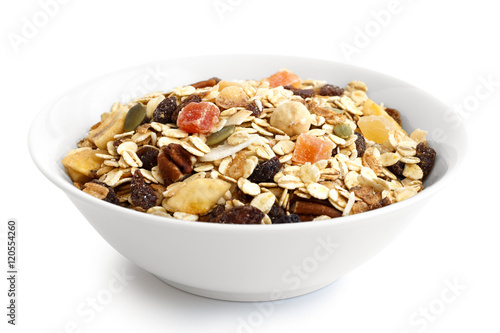 Fotografie Breakfast bowl of fruit and nut muesli isolated on white.