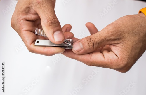 Hands with nail clipper