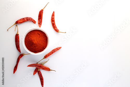 Фотография red chillies with red chilly powder on white background