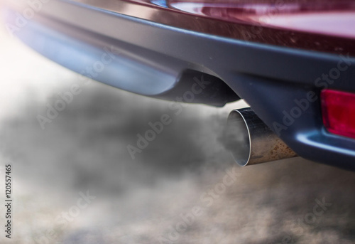 combustion fumes coming out of car exhaust pipe © olando