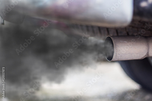 combustion fumes coming out of car exhaust pipe photo