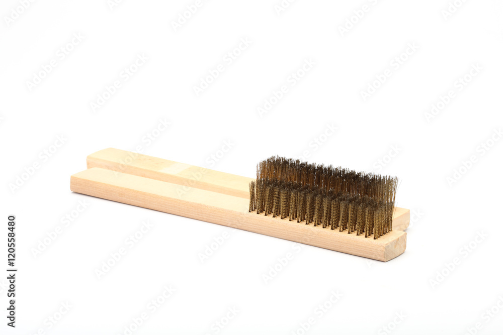 Close-up Brass brush with wooden handle isolated on white backgr Close-up Brass brush with wooden handle isolated on white backgr