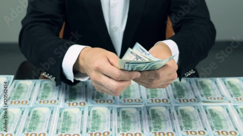 Wallpaper Mural Unrecognizable man hands counting cash. Hundred new US dollar banknotes. 4K. Torontodigital.ca